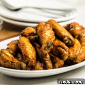 Easy Air Fryer Dinners 14 Air Fried Buffalo Chicken Wings on a white serving dish.