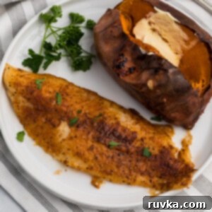 Easy Air Fryer Dinners 8 Blackened Air Fryer Swai Fish on a white plate.