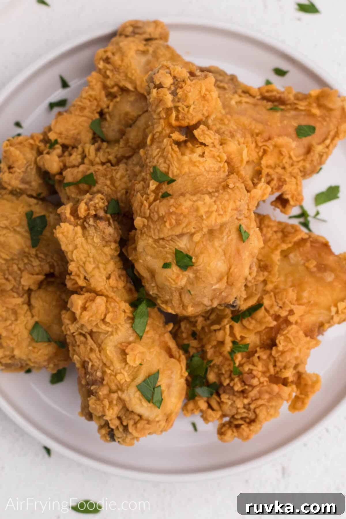 Mastering Air Fryer Leftovers for Crispy Results 4 fried chicken on a plate.