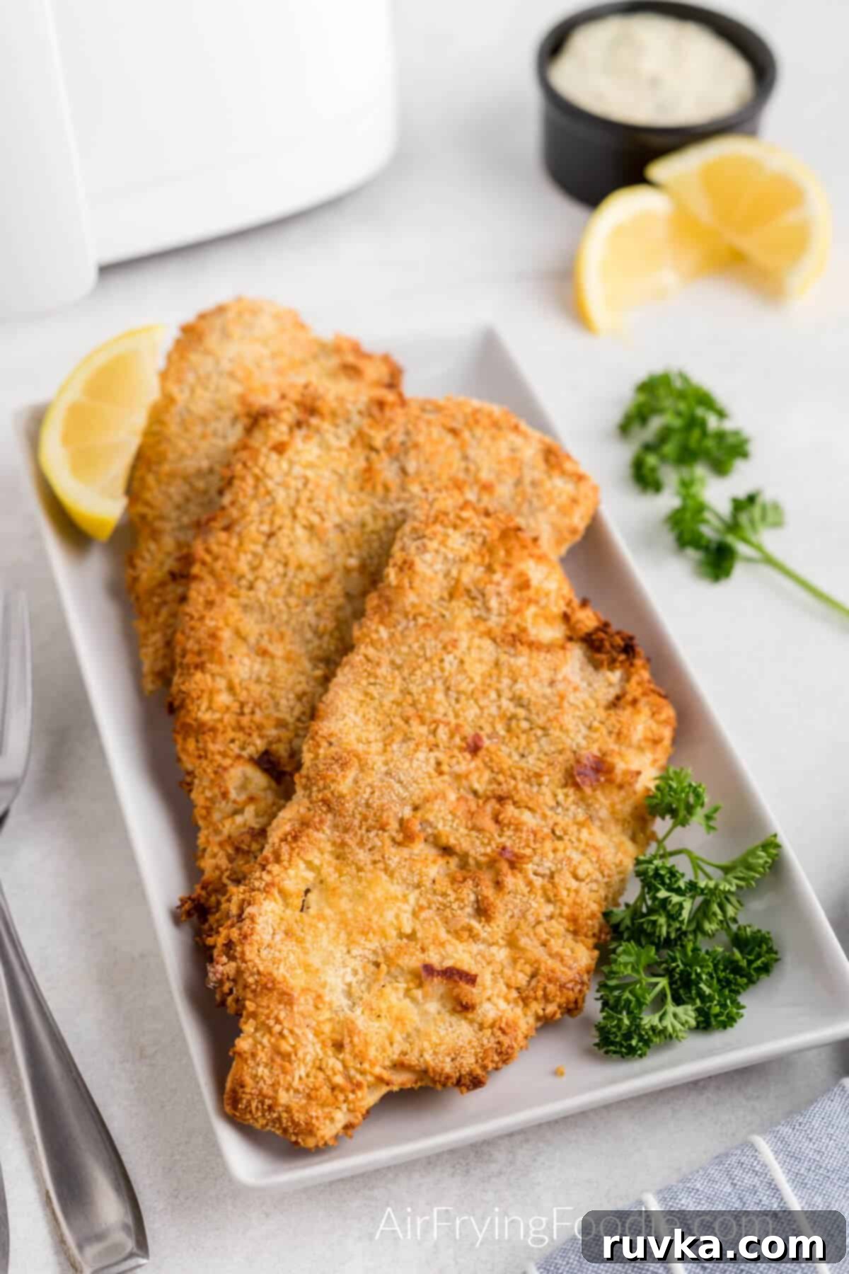 Mastering Air Fryer Leftovers for Crispy Results 5 fried fish on a plate ready to eat.