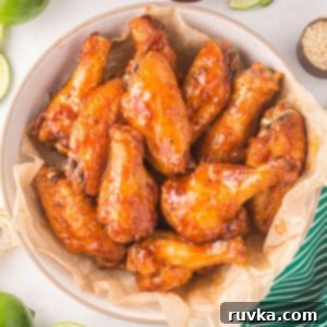 Air Fryer Magic for Crispy Leftover Wings 7 Reheated chicken wings in the air fryer and served in a bowl.