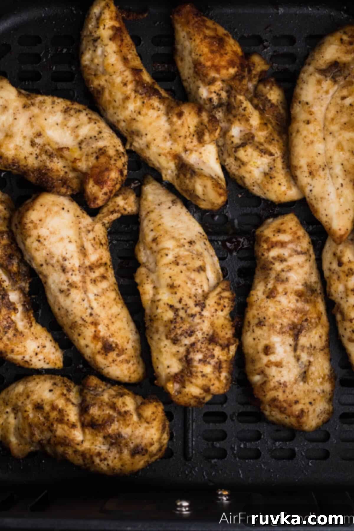 Crispy Air Fryer Chicken Tender Revival 4 Chicken tenders reheated in the air fryer, ready to serve.