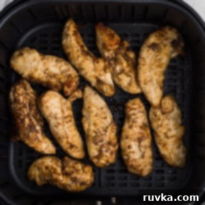 Crispy Air Fryer Chicken Tender Revival 6 Reheated chicken tenders in the air fryer basket.