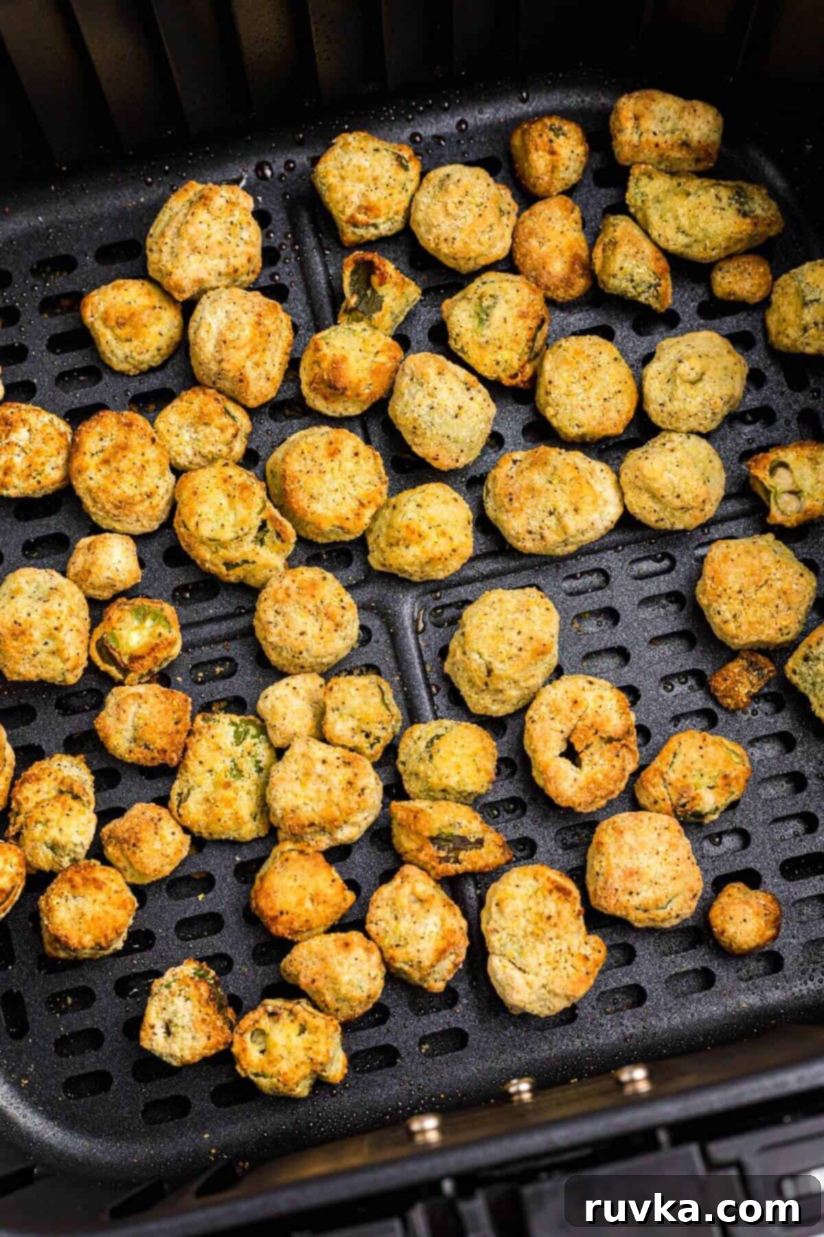 Air Fryer Magic for Frozen Okra 5 Golden breaded frozen okra in the air fryer basket.