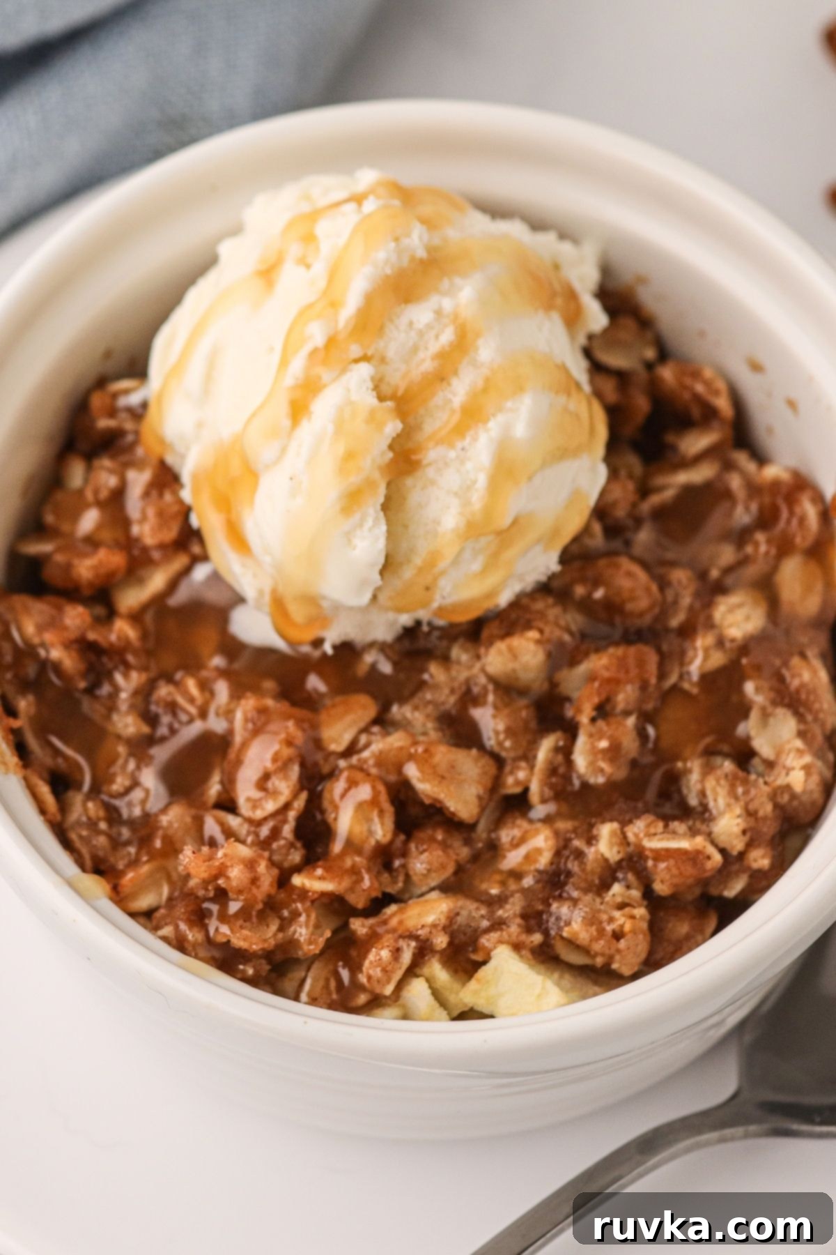 15 Cozy Autumn Air Fryer Desserts You'll Adore 11 Apple crisp made in the air fryer and topped with ice cream.