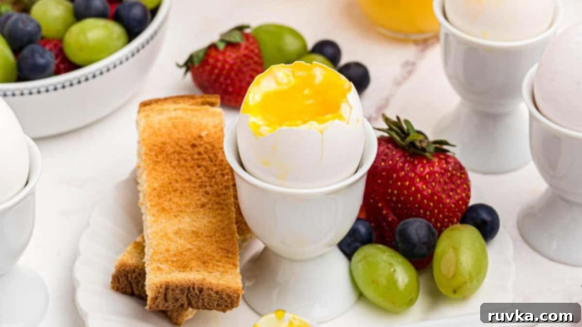 15 Effortless Breakfasts for a Perfect Start 12 A perfectly cooked air fryer soft-boiled egg, gently cracked open to reveal a runny yolk, served with fresh fruit and toast, creating an appealing and healthy breakfast spread.
