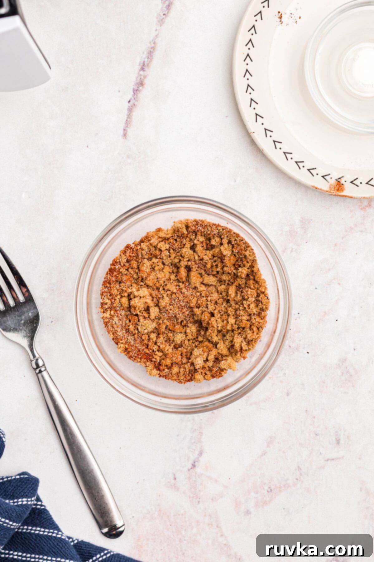 No-Thaw Air Fryer Pork Chops 5 Small glass bowl with seasonings mixed together making the pork chop rub.