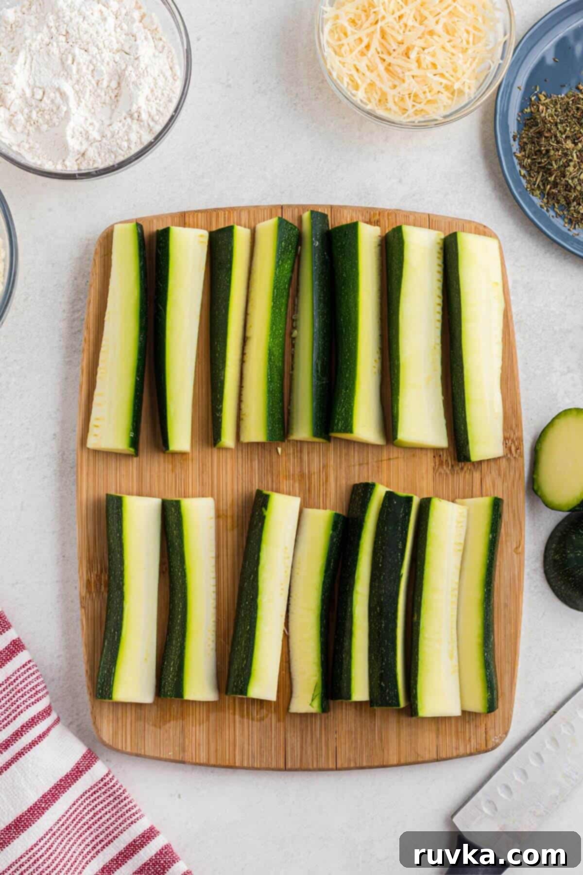 Guilt-Free Air Fryer Zucchini Fries 4 Zucchini cut into slices before breading them.