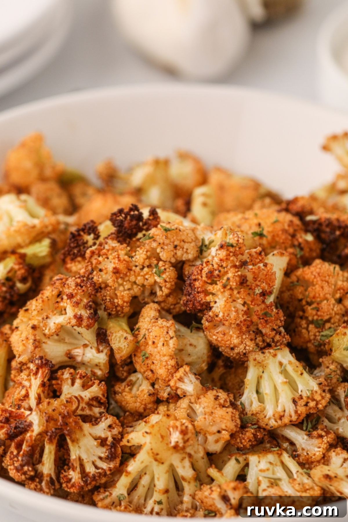 Effortless Holiday Feasts: 15 Air Fryer Recipes 14 Air fryer cauliflower in a bowl