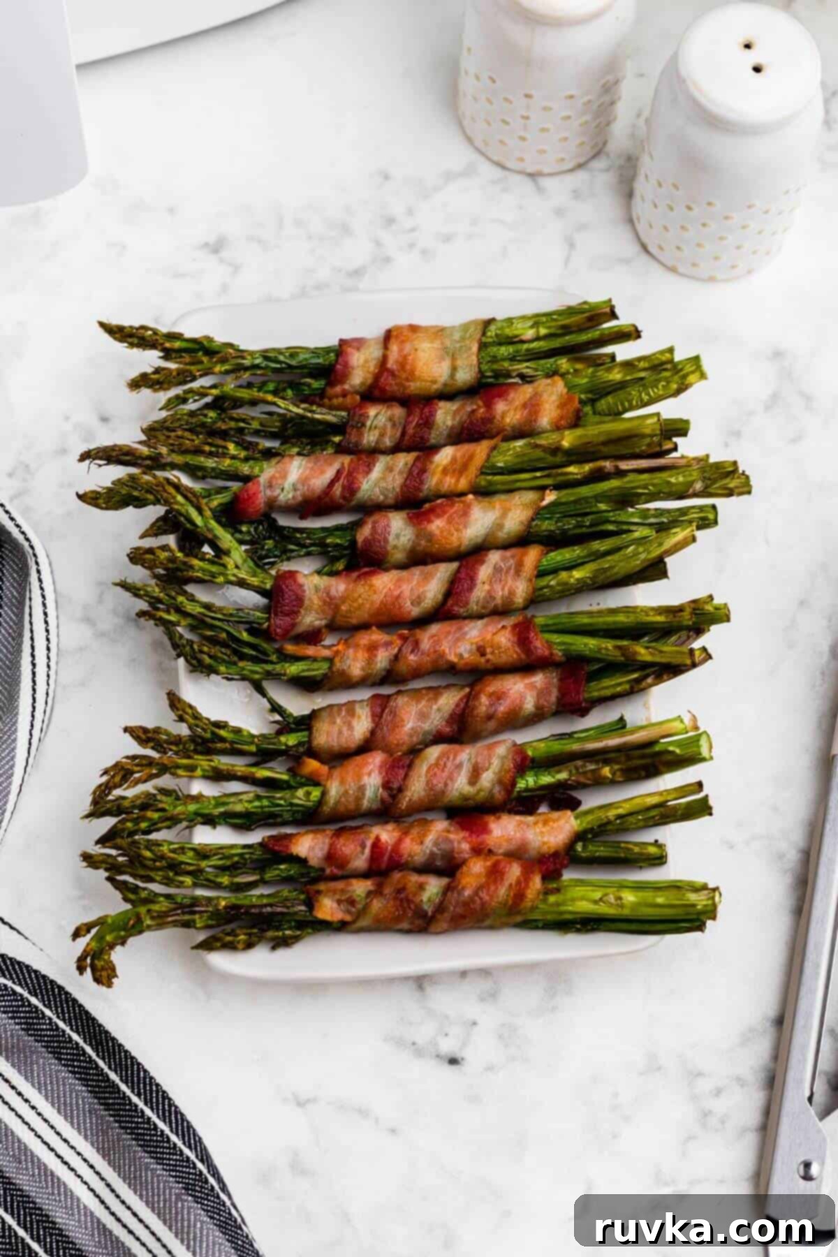 Effortless Holiday Feasts: 15 Air Fryer Recipes 17 overhead shot of bacon wrapped asparagus.