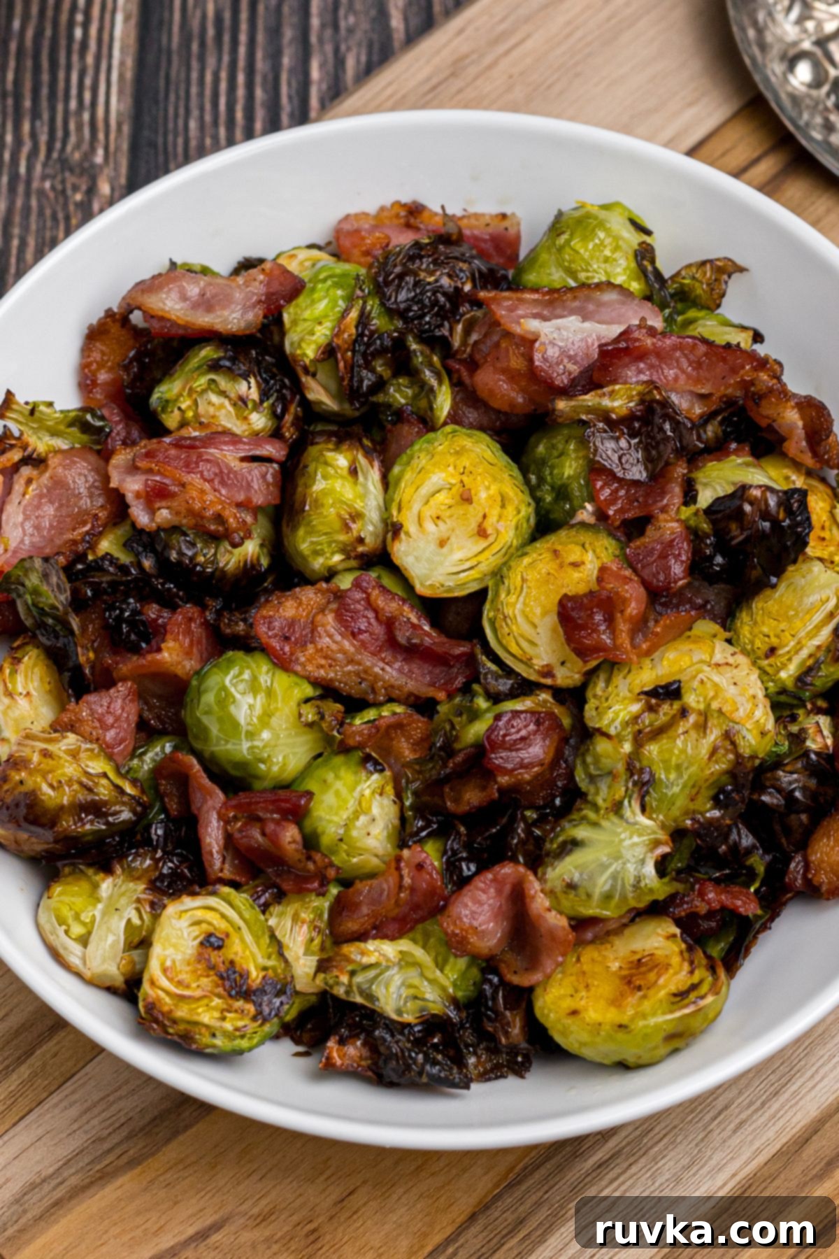 Effortless Holiday Feasts: 15 Air Fryer Recipes 6 Plate of air fried brussels sprouts and bacon.