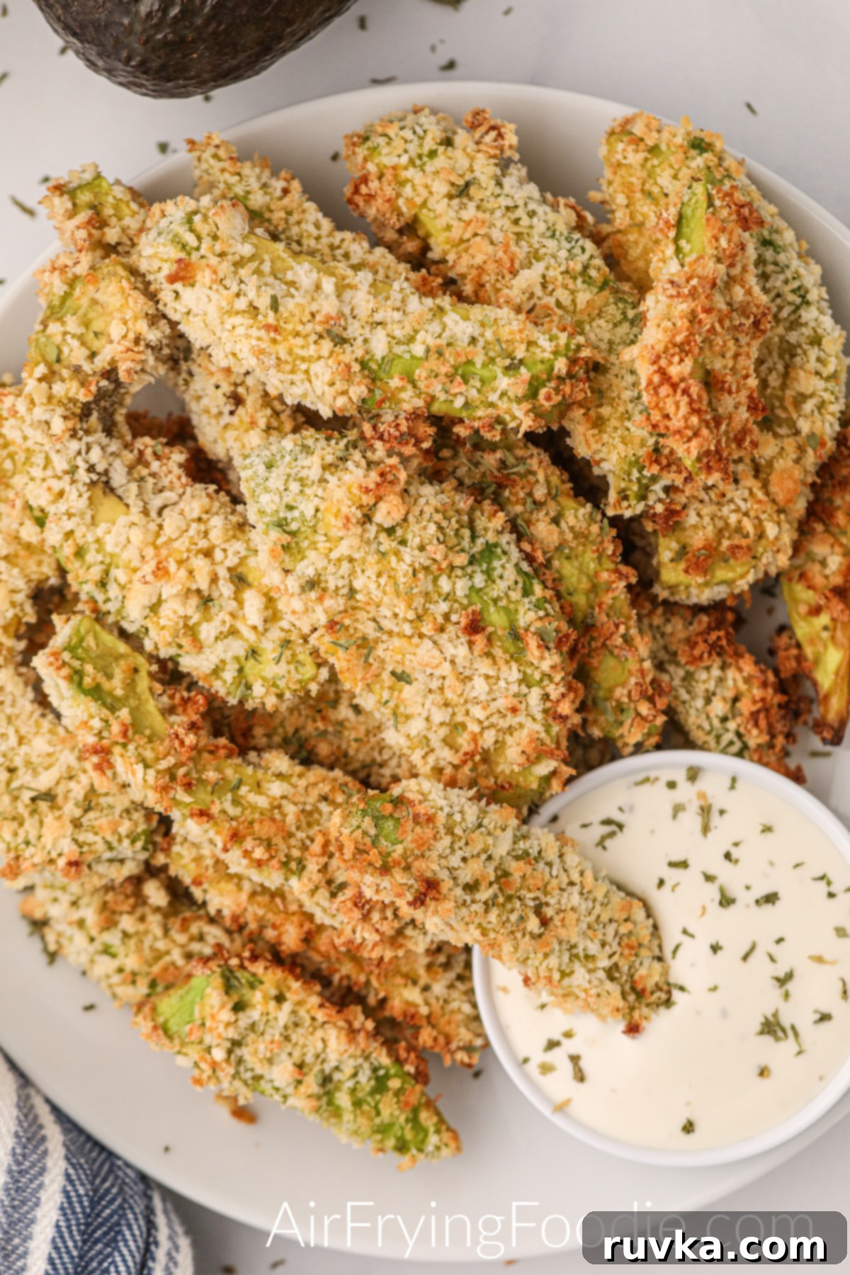 Sizzle into the New Year: 15 Air Fryer Recipes to Revolutionize Your Cooking 11 avocado fries with dipping sauce.