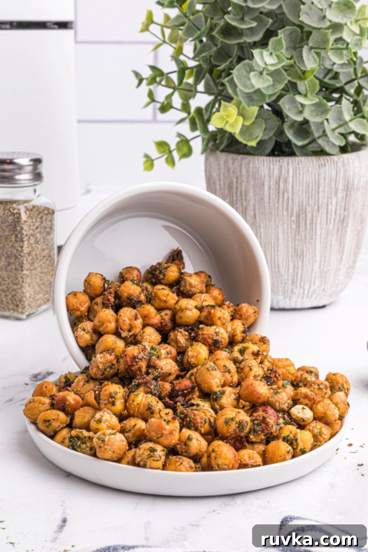 Sizzle into the New Year: 15 Air Fryer Recipes to Revolutionize Your Cooking 5 chickpeas poured onto a white plate.
