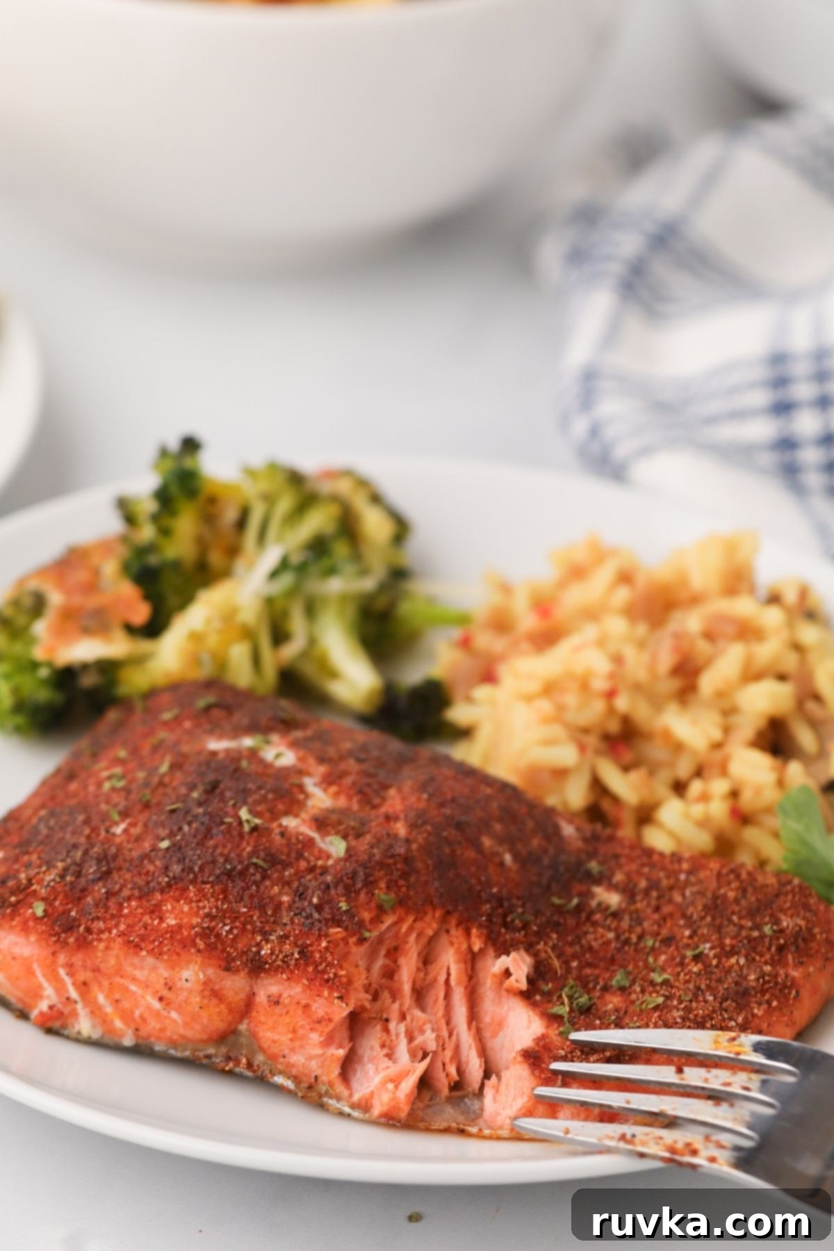Sizzle into the New Year: 15 Air Fryer Recipes to Revolutionize Your Cooking 6 salmon on a plate with sides, ready to eat.