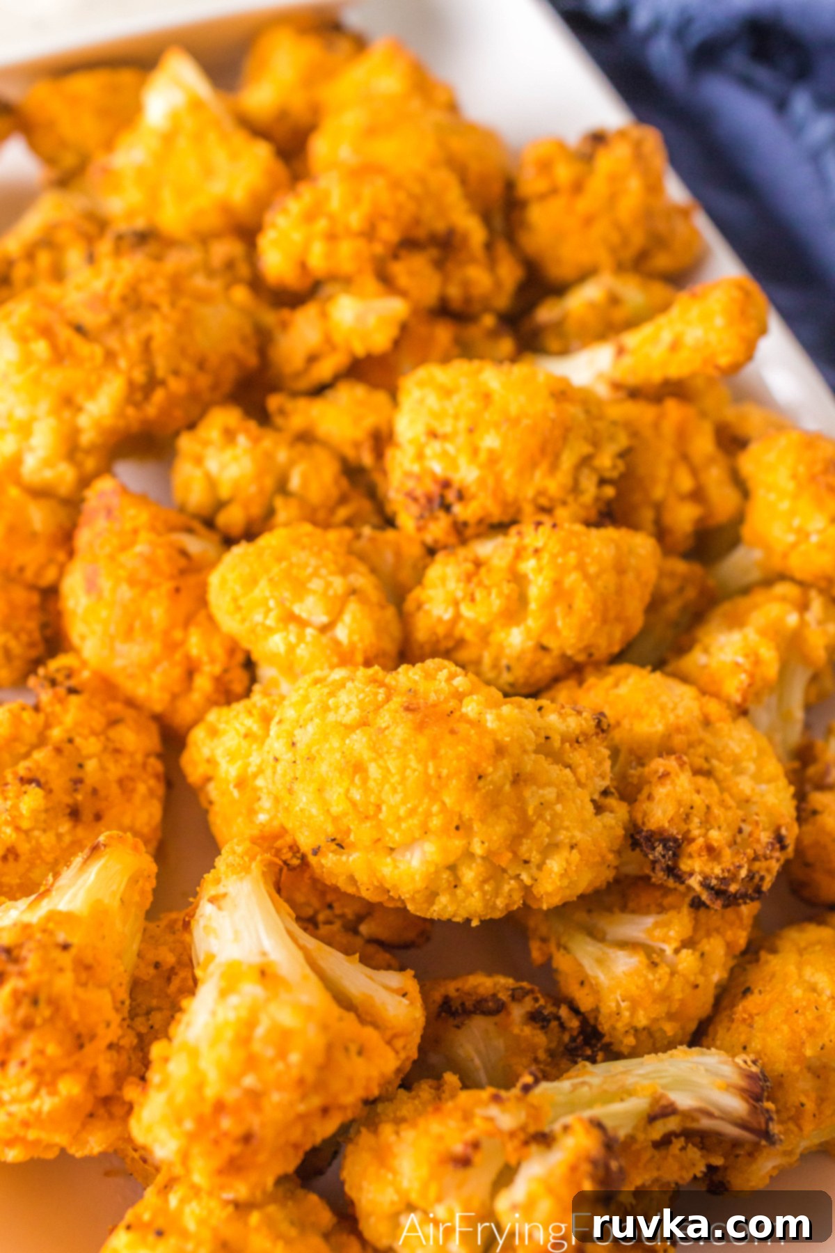 Sizzle into the New Year: 15 Air Fryer Recipes to Revolutionize Your Cooking 8 buffalo cauliflower bites on a platter ready to serve
