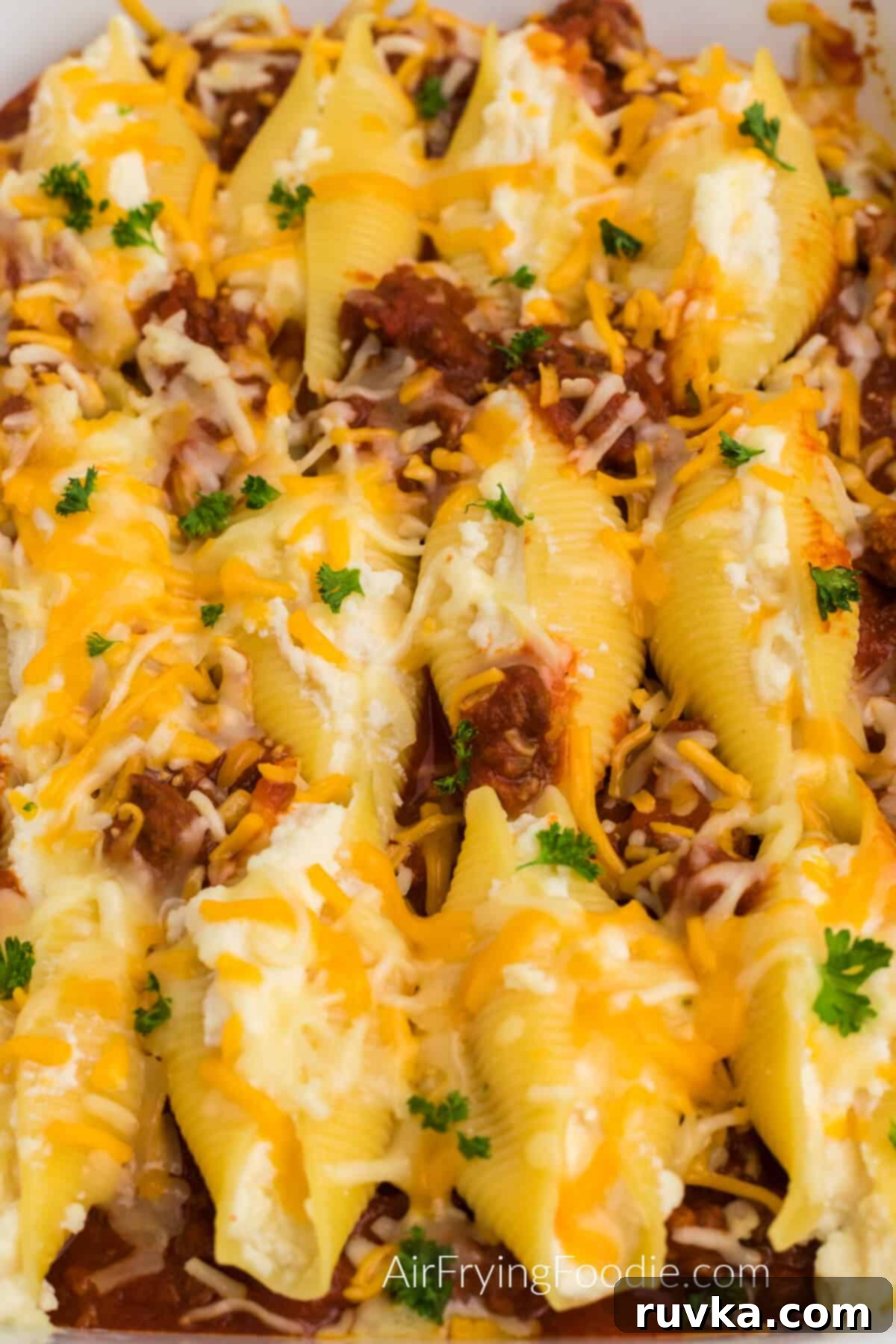 Quick and Delicious Air Fryer Lasagna Shells 5 Lasagna stuffed shells fresh from the air fryer oven, showing the golden cheesy top and rich filling.