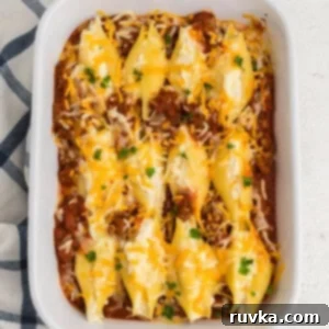 Quick and Delicious Air Fryer Lasagna Shells 6 Lasagna stuffed shells in a casserole dish, ready to serve.