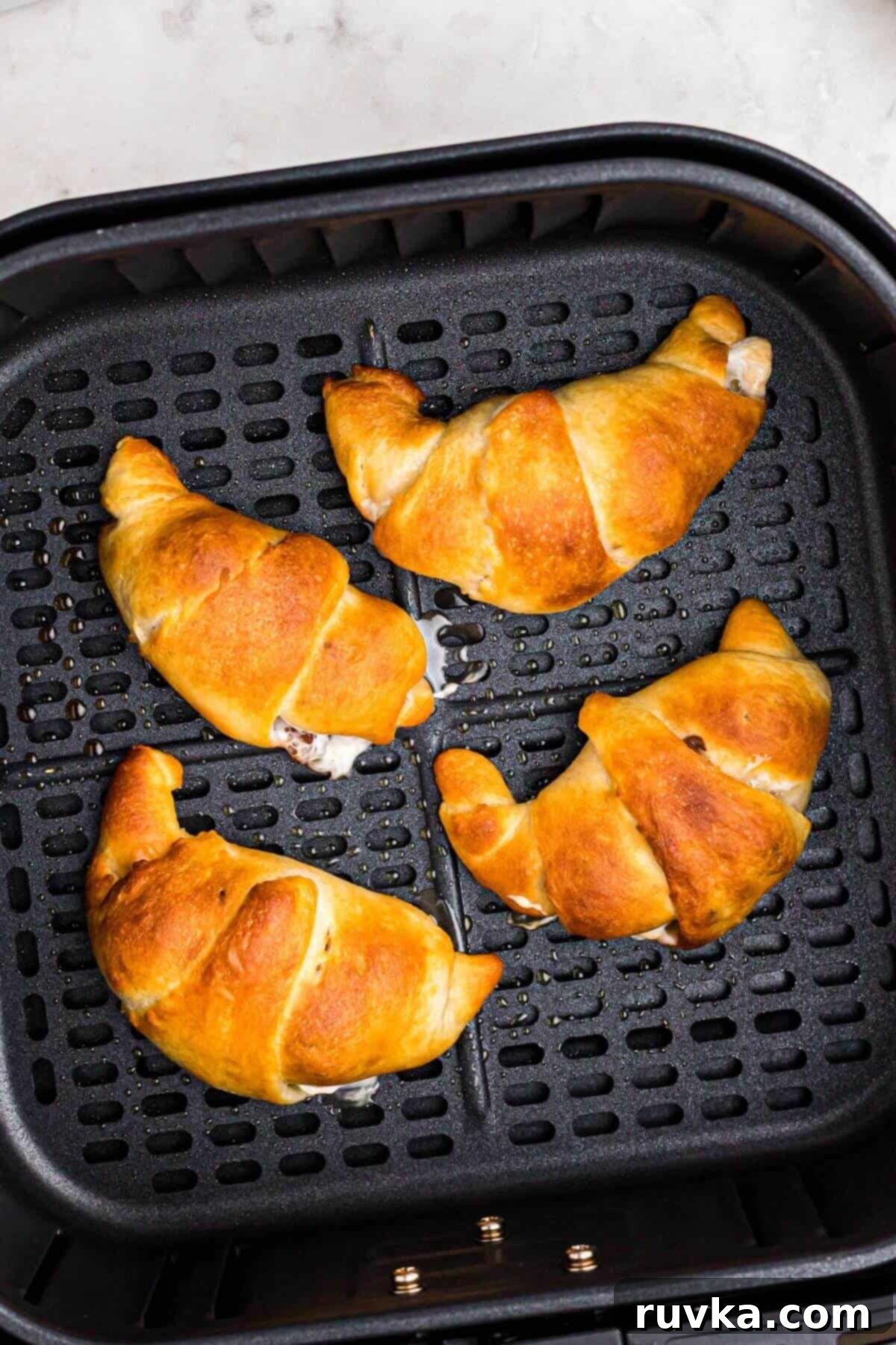 Air Fryer S'mores Crescent Rolls 6 Golden flaky crescents filled with gooey marshmallows and mini chocolate chips.