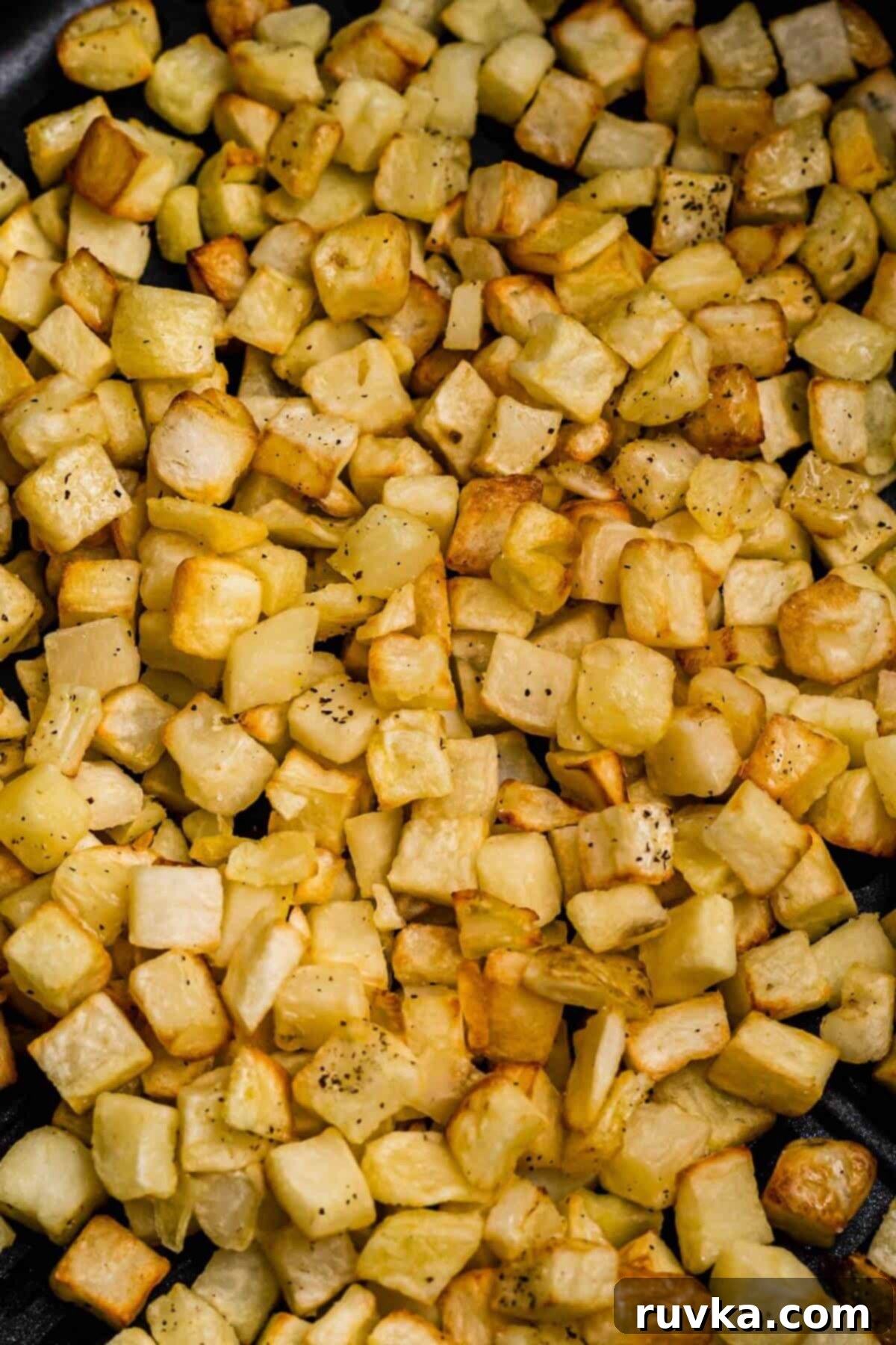 Crispy Air Fryer Frozen Potatoes 6 Golden and crispy cooked diced potatoes after being cooked and seasoned in the air fryer.