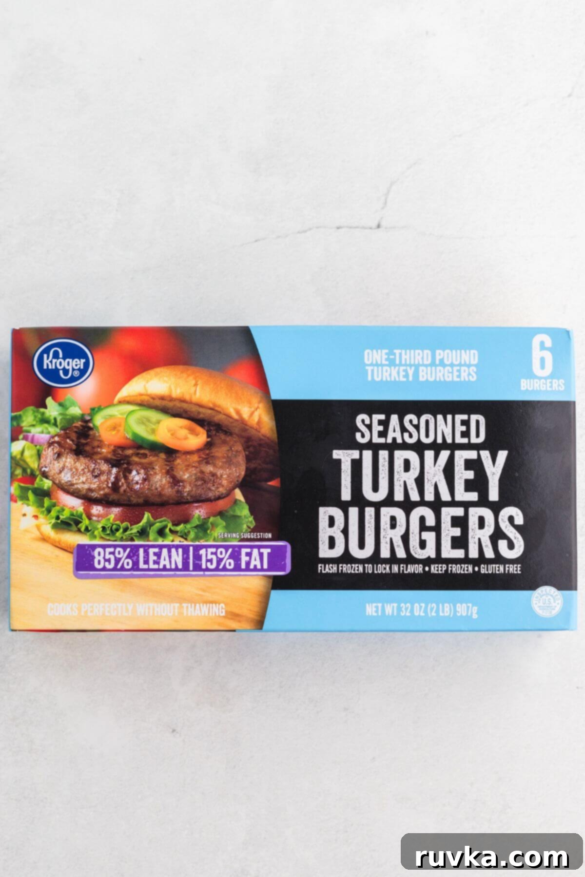 Perfect Air Fryer Frozen Turkey Burgers 3 Box of Kroger seasoned frozen turkey burgers on a pristine white marble table, ready for cooking.