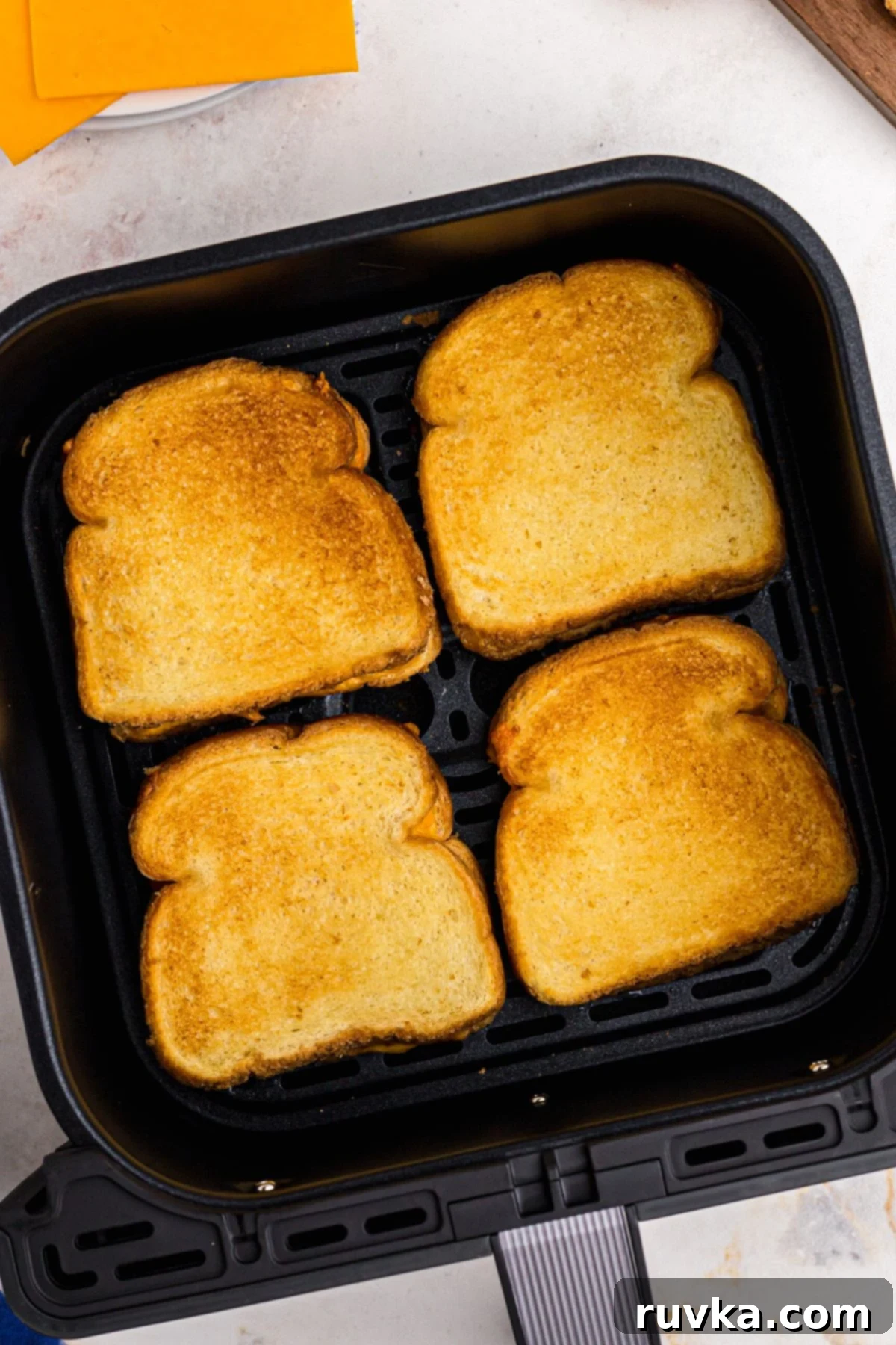 Golden and Gooey Air Fryer Grilled Cheese 6 golden crispy grilled cheese sandwiches in the air fryer basket