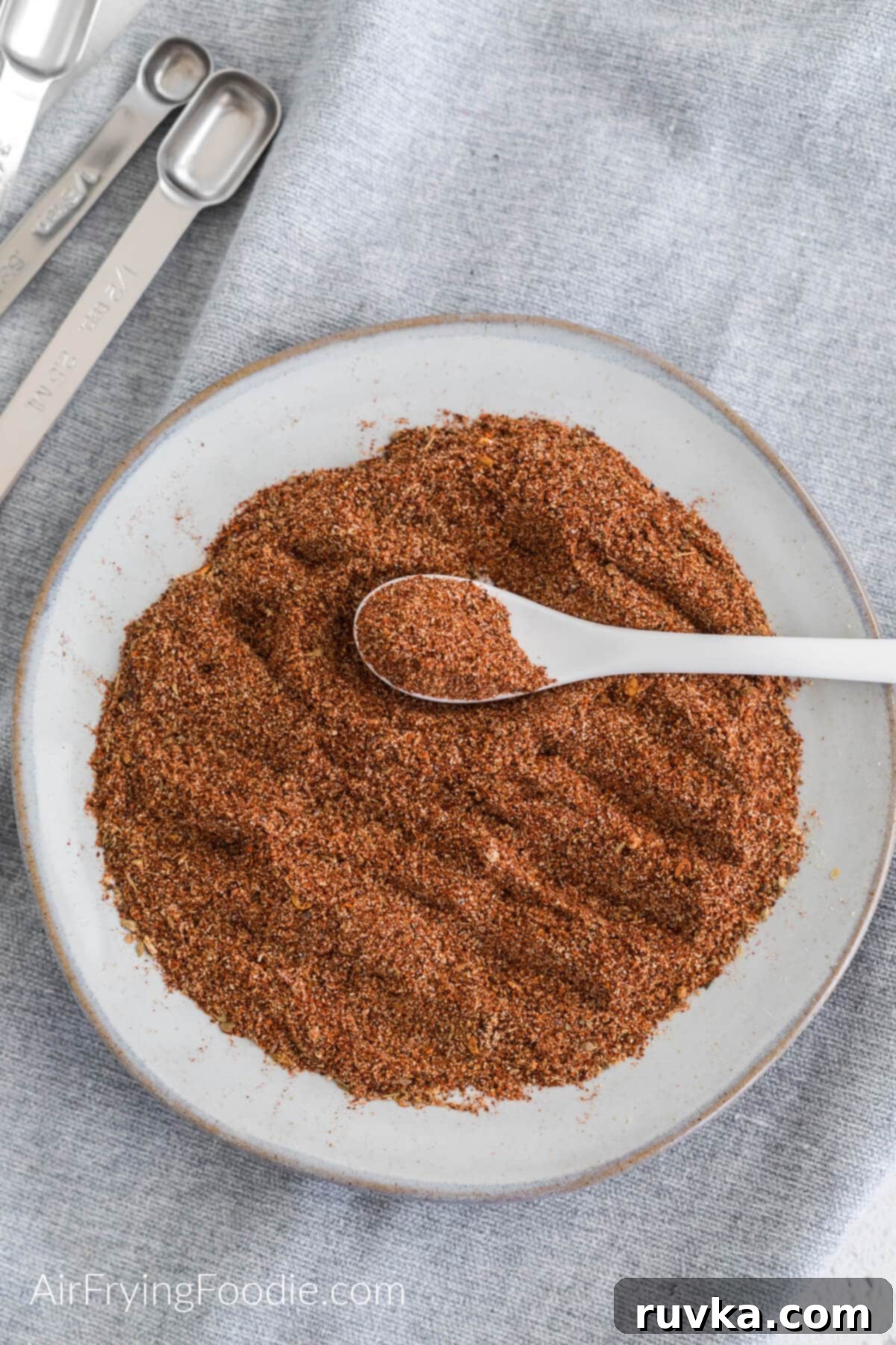 Craft Your Own Taco Spice Blend 2 Homemade taco seasoning on a white plate, ready to be used.