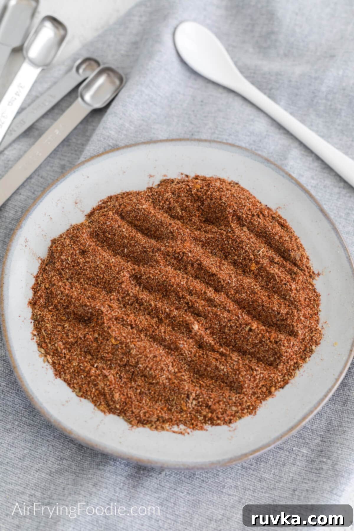 Craft Your Own Taco Spice Blend 6 Taco seasoning mixed together on a white plate and ready to use.