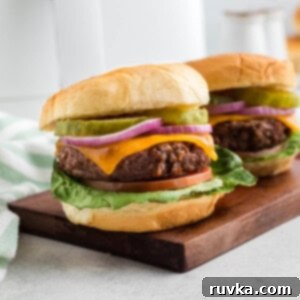 Easy Air Fryer Beyond Burger 9 Close up of two air fried Beyond burgers on a cutting board.
