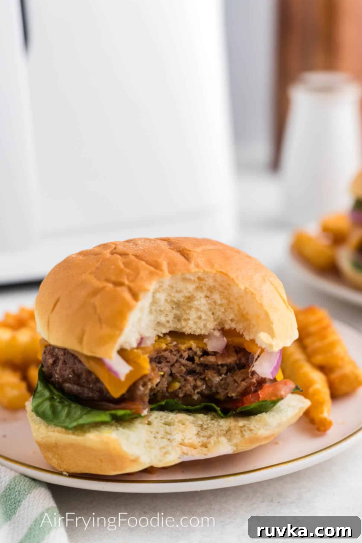 Easy Air Fryer Beyond Burger 8 Close up of an air fried Beyond burger that's been air fried with a bite taken from it.