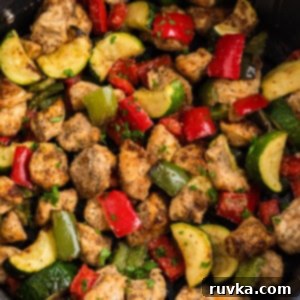 Crispy Air Fryer Chicken and Roasted Vegetables 7 chicken and vegetables in the basket of the air fryer, ready to eat.