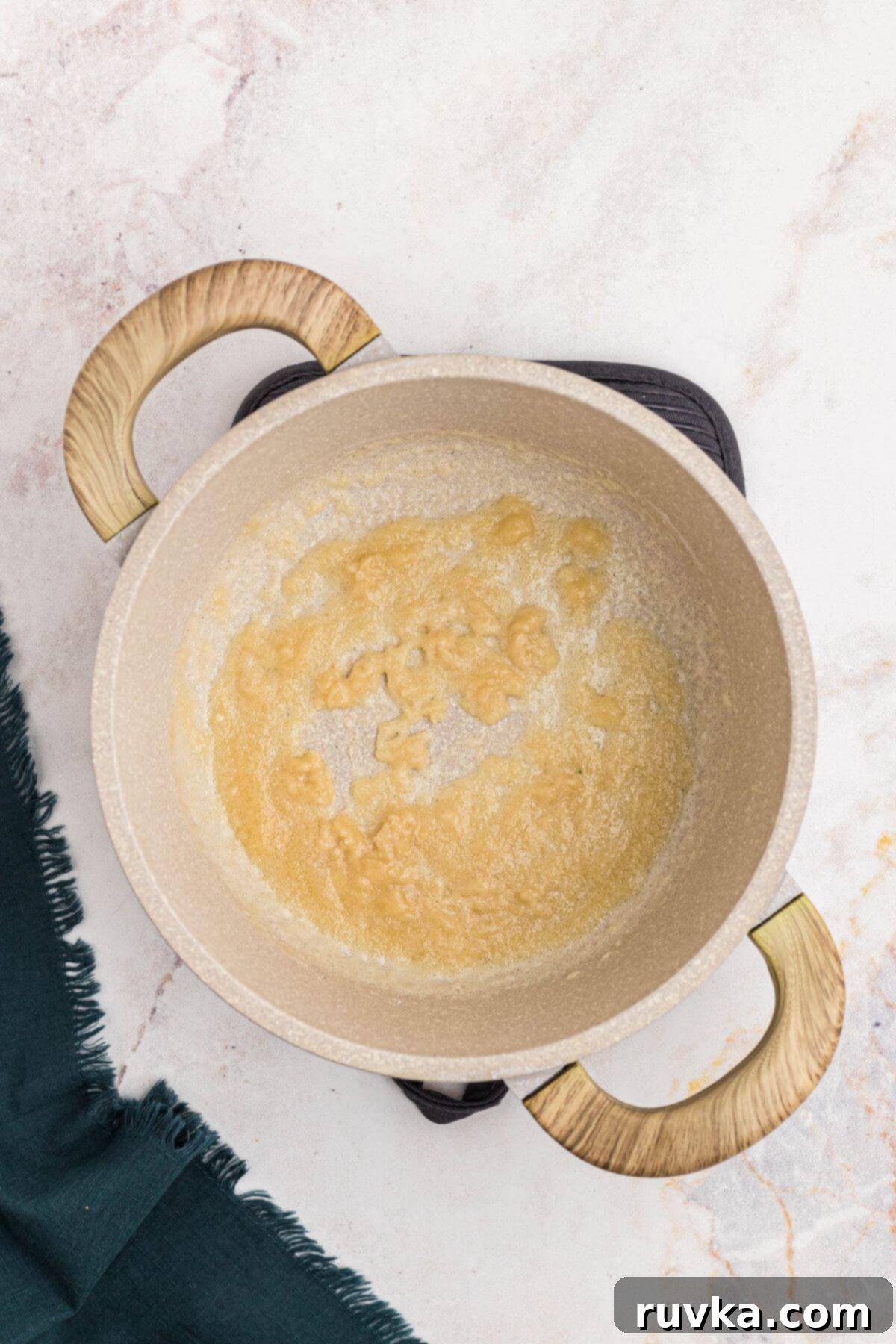 Creamy Cheese Sauce 4 Paste mixture of flour and butter mixed together in a pan.