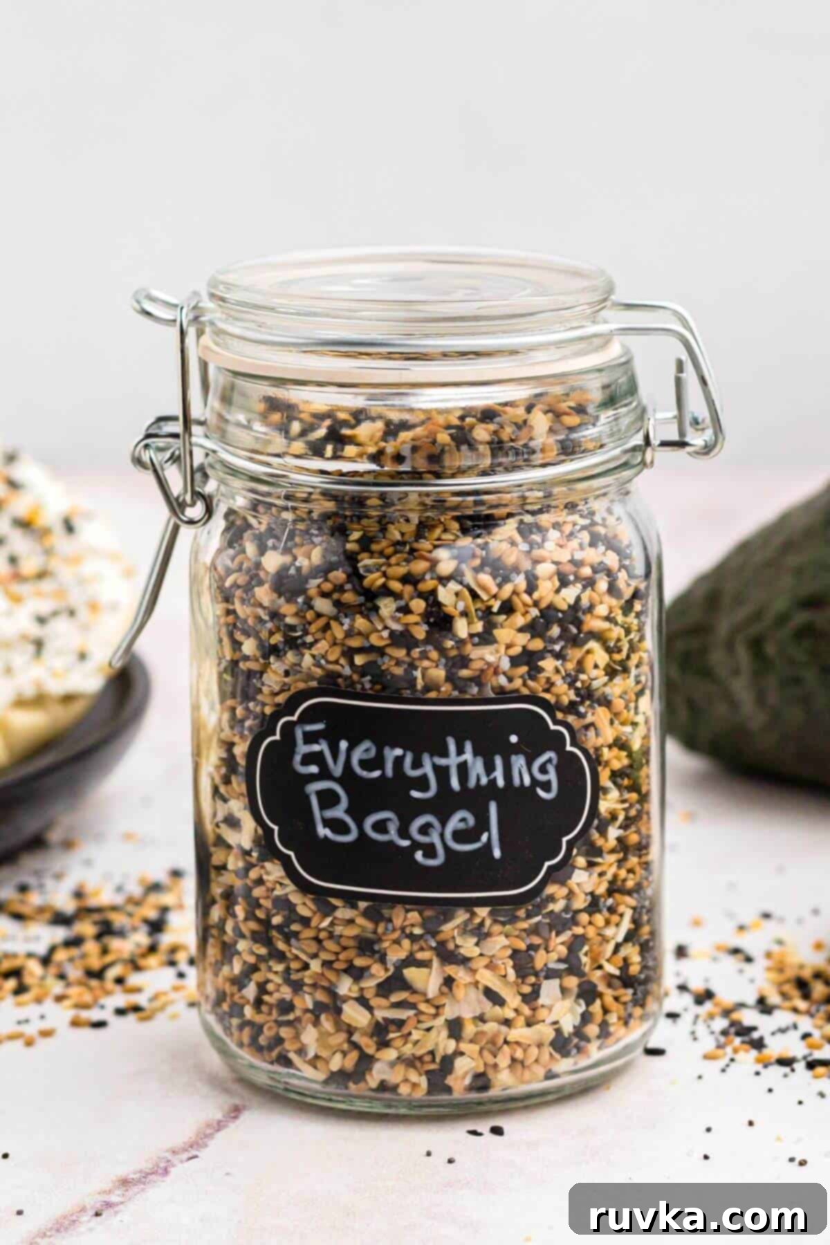 DIY Everything Bagel Seasoning 5 Small jar with a sealable lid filled with everything bagel seasoning.