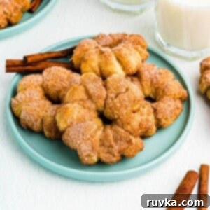 Flaky Air Fryer Apple Rings 13 Golden brown air fried apple rings wrapped in puff pastry.