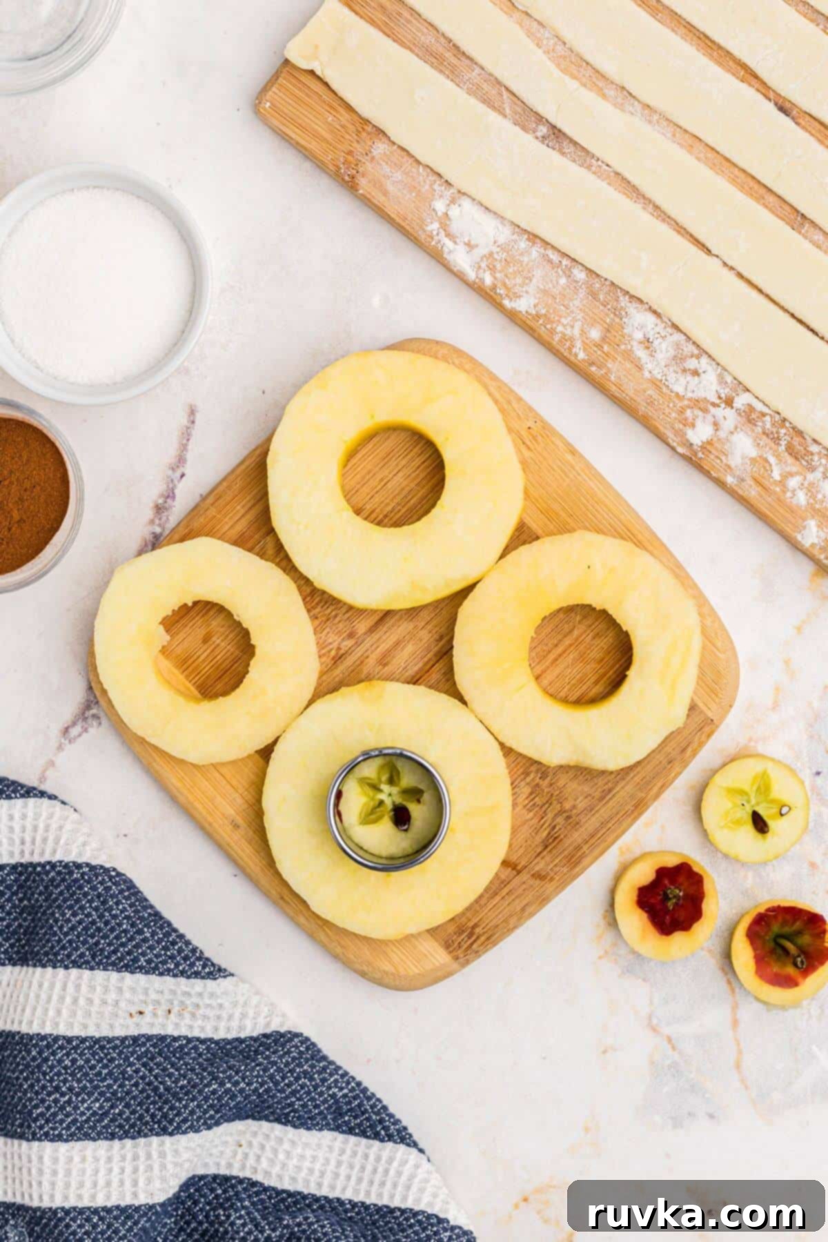 Flaky Air Fryer Apple Rings 5 Peeled and cored apples, cut into slices like rings, with the center being removed making a hole.