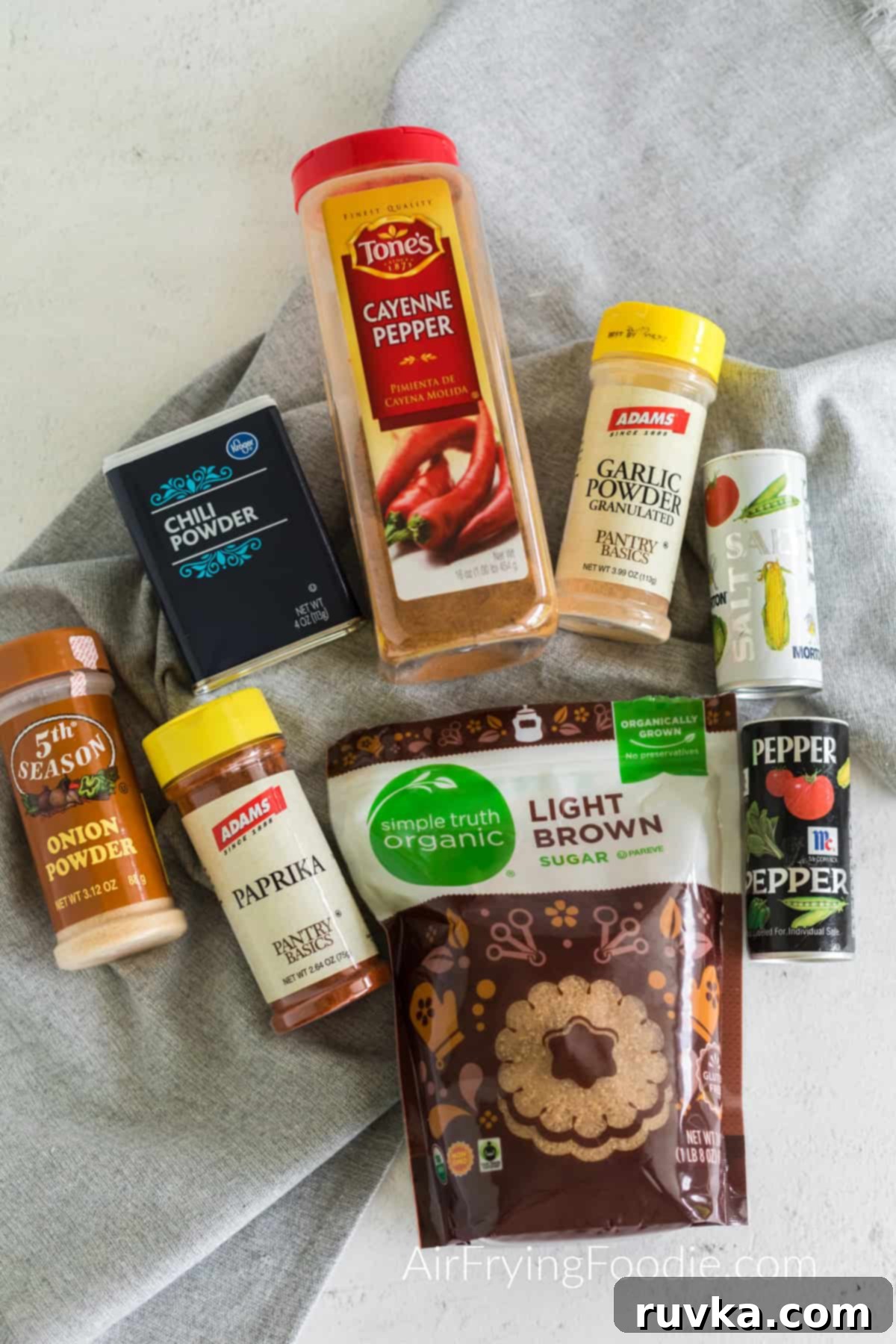 Master Your Own BBQ Rub 3 Seasonings on a table that are needed to make a homemade bbq rub.