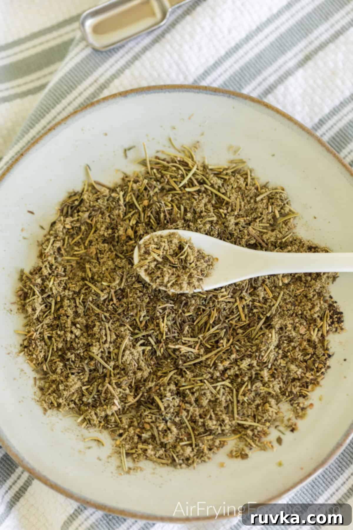 Flavorful Homemade Poultry Seasoning 2 Homemade poultry seasoning in a dish with a spoon ready to use.