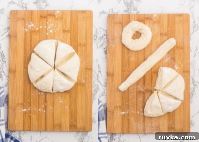 Easy Air Fryer Two-Ingredient Bagels 4 Dough formed into a circle and cut into 6 pieces on a cutting board, and then rolled and shaped into a circle bagel.