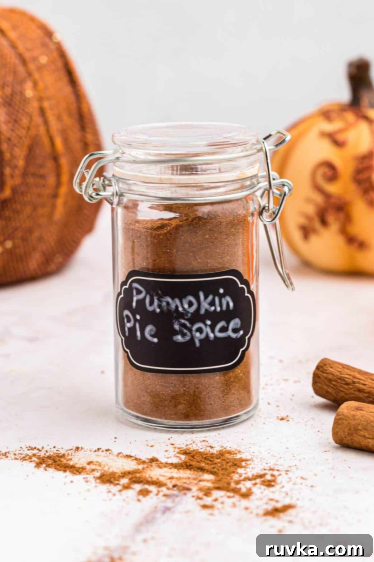 Autumn Spice Blend 5 Pumpkin spice in a small spice jar on a marble table.