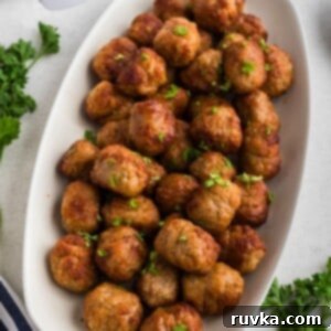 Quick Air Fryer Frozen Meatballs 6 Golden juicy frozen meatballs after being cooked in the air fryer.