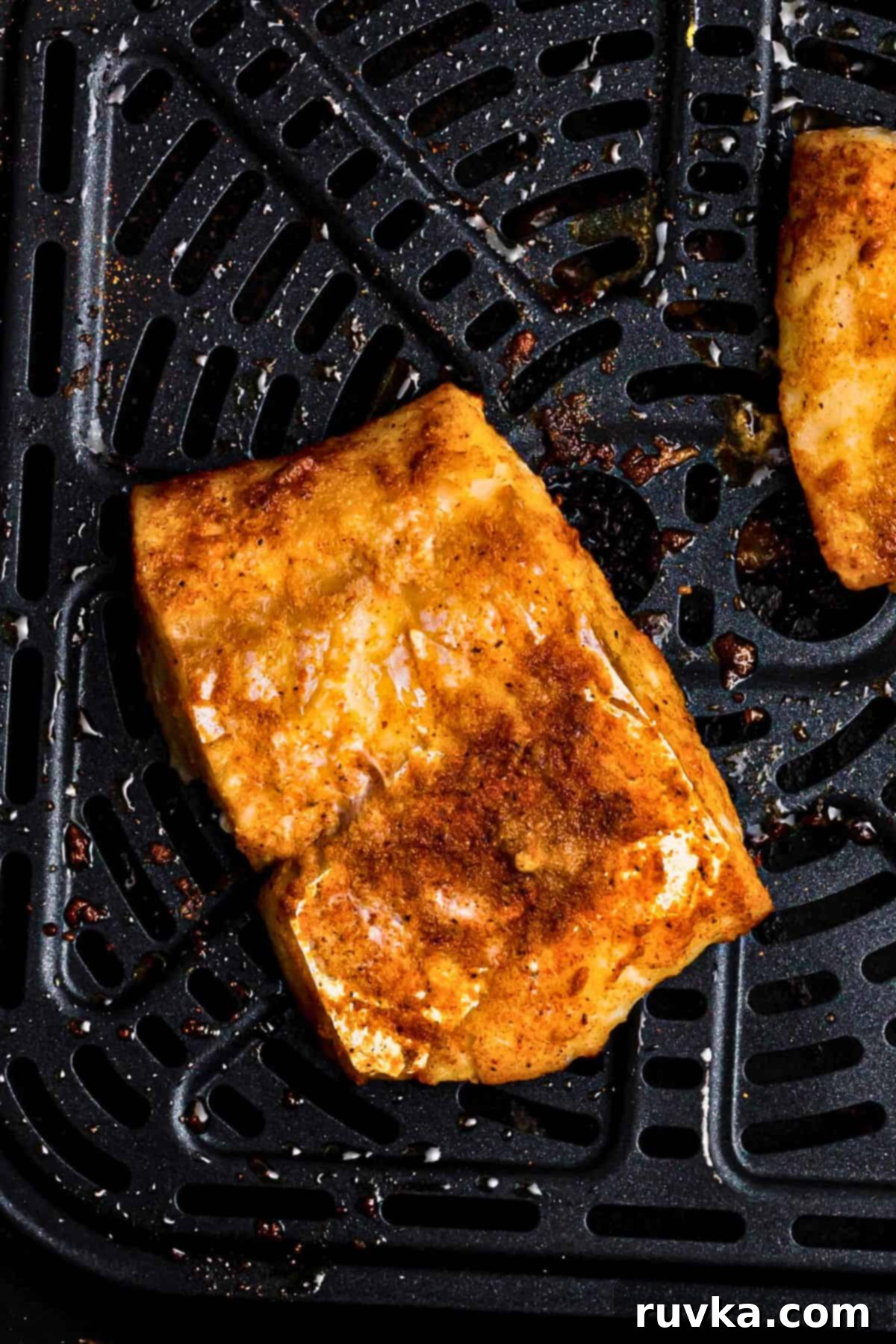 Perfect Air Fryer Frozen Cod 6 Juicy, moist cod filets after they are seasoned and air fried.
