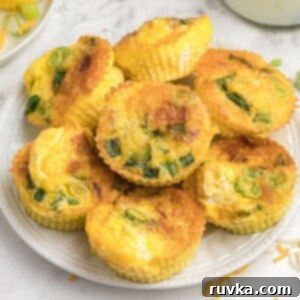 Point-Friendly Air Fryer Dishes 12 Close up photo of egg bites stacked on top of a white plate.