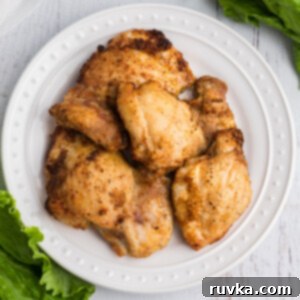 Point-Friendly Air Fryer Dishes 7 overhead photos of chicken thighs fully cooked in the air fryer and served on a white plate.