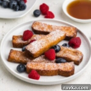 Crispy Air Fryer Frozen French Toast Sticks 9 Air fried frozen french toast sticks fully cooked and topped with berries and powdered sugar. Ready to eat.
