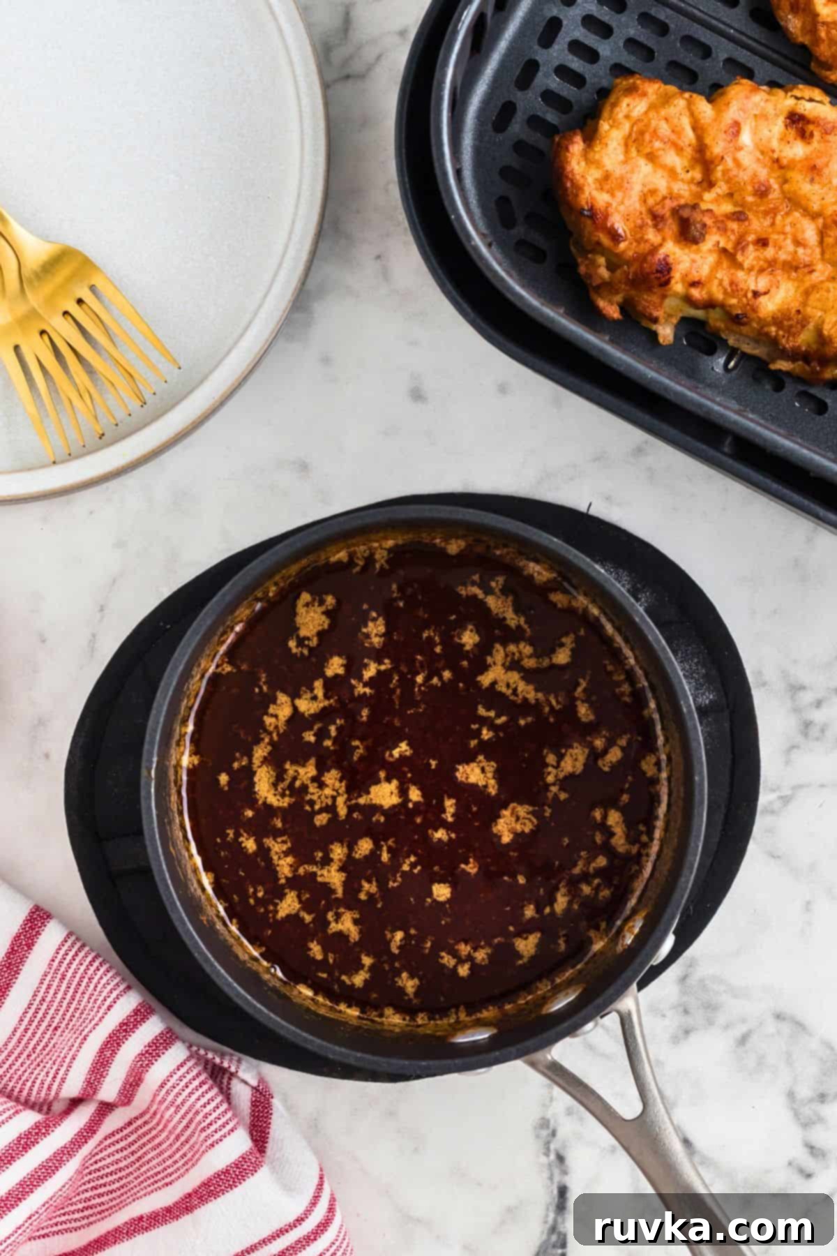 Crispy Air Fryer Nashville Hot Chicken 7 Melted butter being mixed with brown sugar and other ingredients to make the hot sauce.