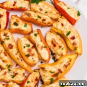 Crispy Air Fryer Stuffed Mini Peppers 9 Air Fryer Stuffed Mini Peppers on a plate.