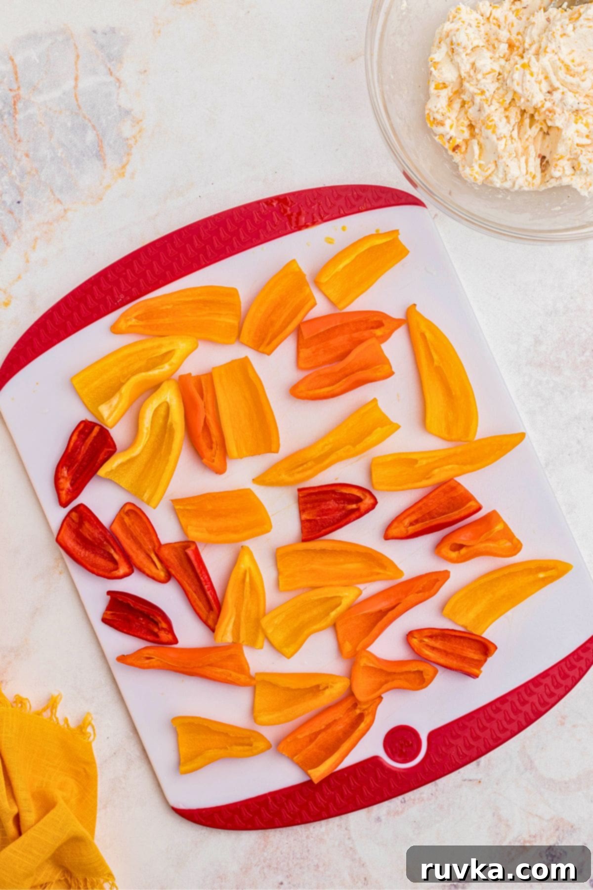 Crispy Air Fryer Stuffed Mini Peppers 5 Mini peppers neatly sliced in half with membranes and seeds removed, ready for stuffing.