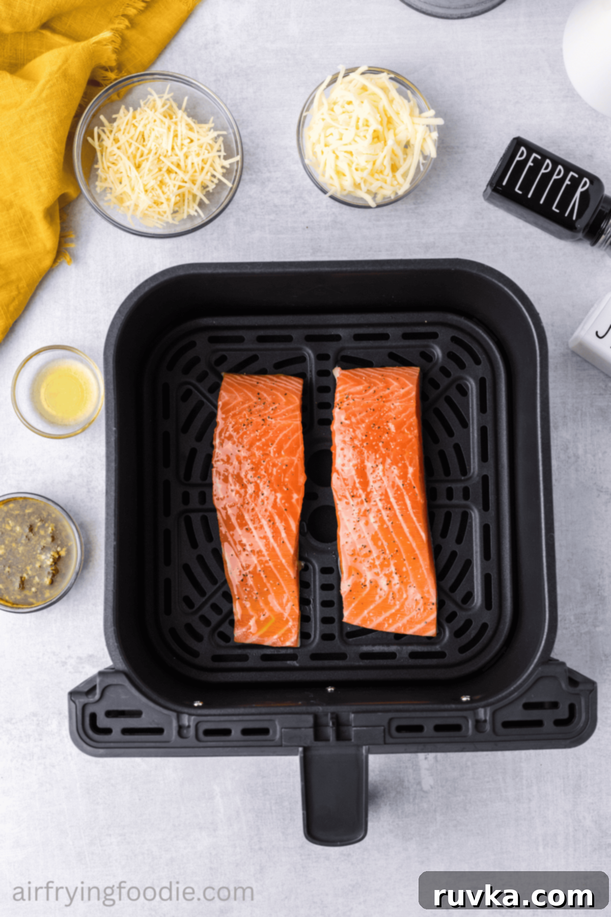 Crispy Air-Fried Pesto Parmesan Salmon 5 Salmon fillets seasoned with a light sprinkle of salt and freshly ground black pepper.