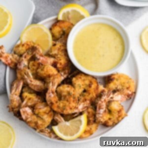 Crispy Keto Air Fryer Shrimp 6 Crispy Air Fryer Keto Fried Shrimp served with lemon and dipping sauce.