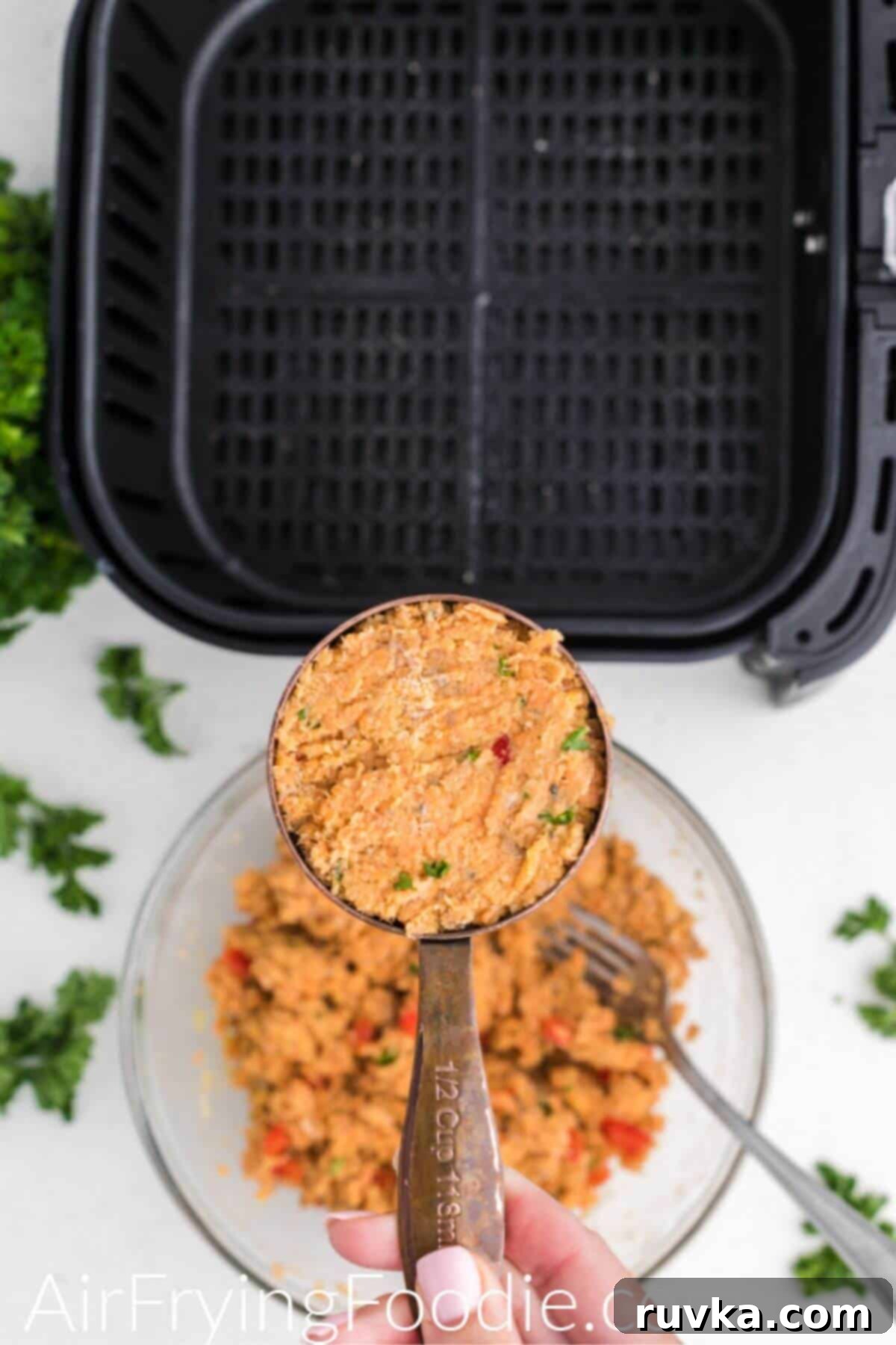 Crispy Air Fryer Salmon Cakes 5 Salmon mixture in a measuring cup before being shaped into a patty and air fried.