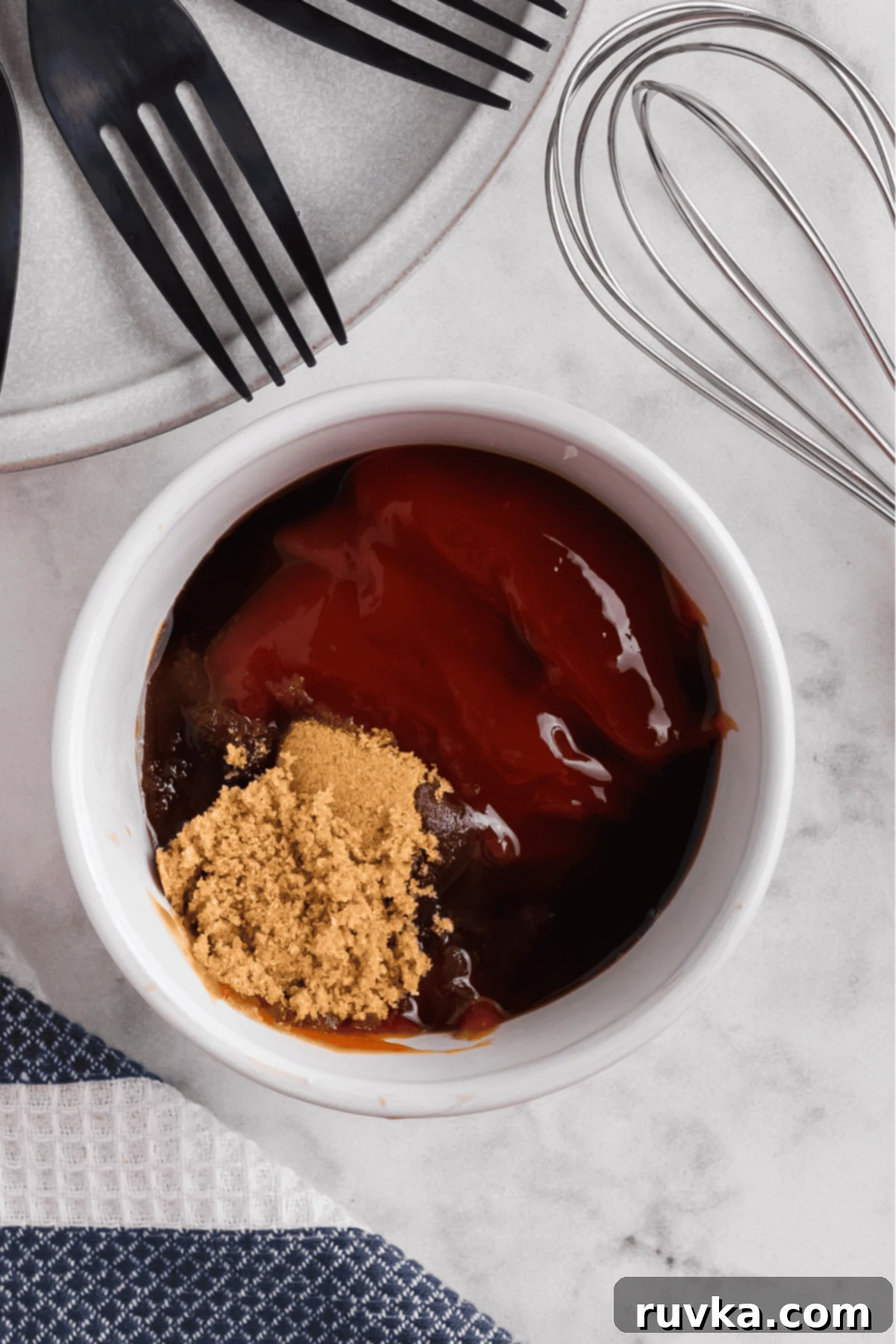 Ketchup, brown sugar, and Worchestershire sauce in a small bowl to make a glaze for the meatloaf.